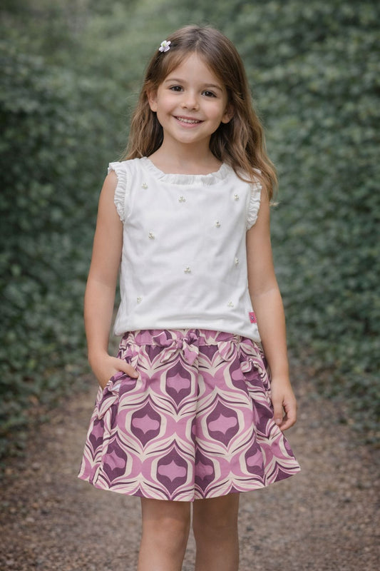 CONJ 2P BLUSA SIN MANGAS DETALLES DE PERLAS Y SHORT ESTAMPADO Y MOÑO